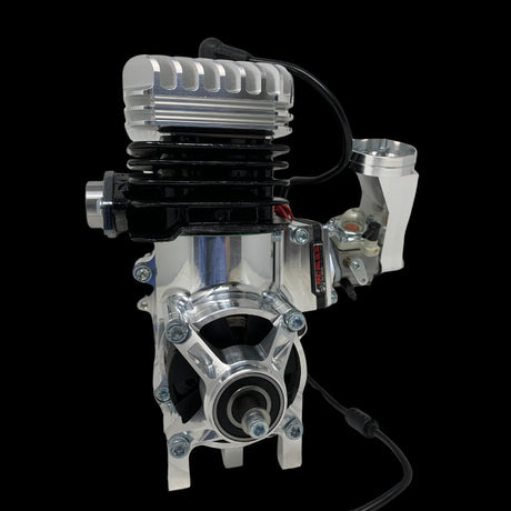 A TAYLOR 46cc billet reed engine with a custom GT triple exhaust port cylinder, visible wiring, and a spark plug, against a black background.