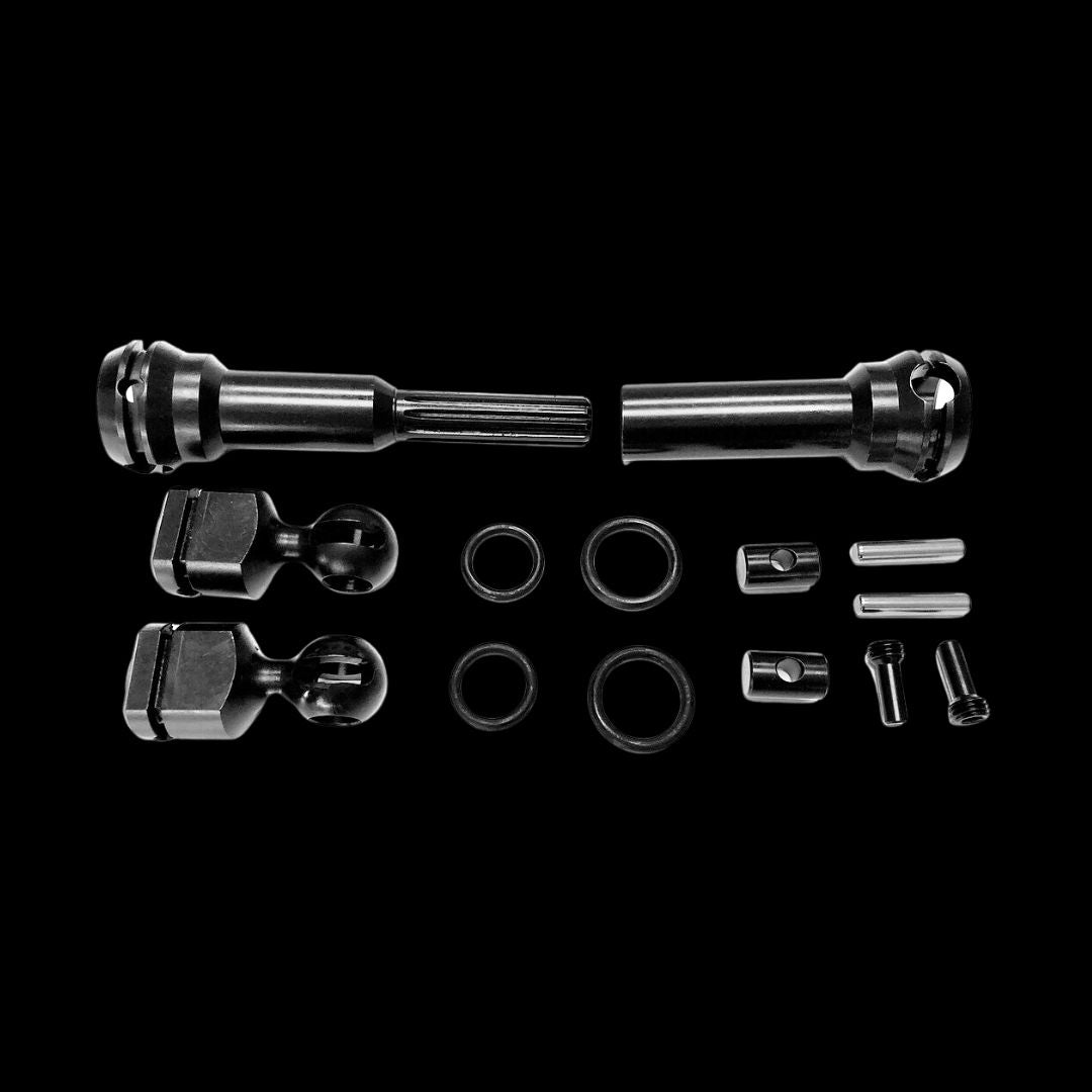 An image showing the components of the Kraken VEKTA.5 CVD Rear Driveshaft System, including metal shafts, retainer rings, and other assembly parts.