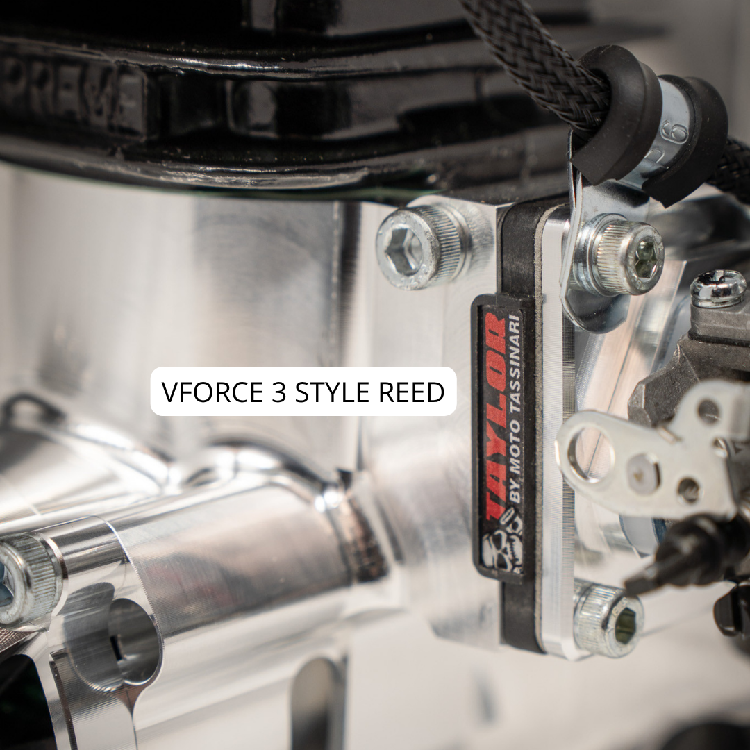 Close-up of a motorcycle engine with 'VForce 3 Style Reed' and 'Moto Tassinari' branding.