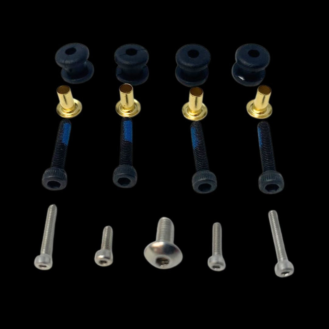 An assortment of RC model vehicle spare hardware including screws and fasteners.