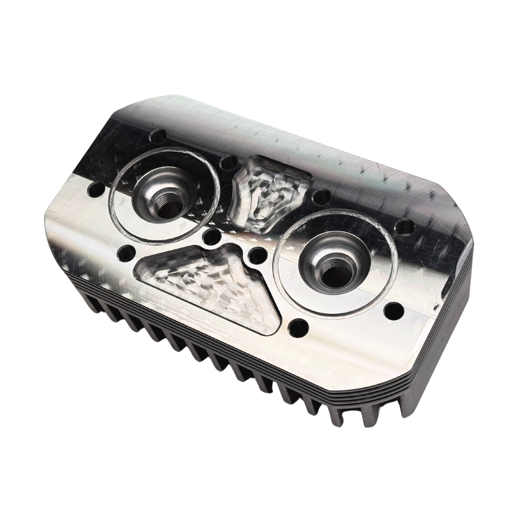 Metallic engine cylinder head on a white background