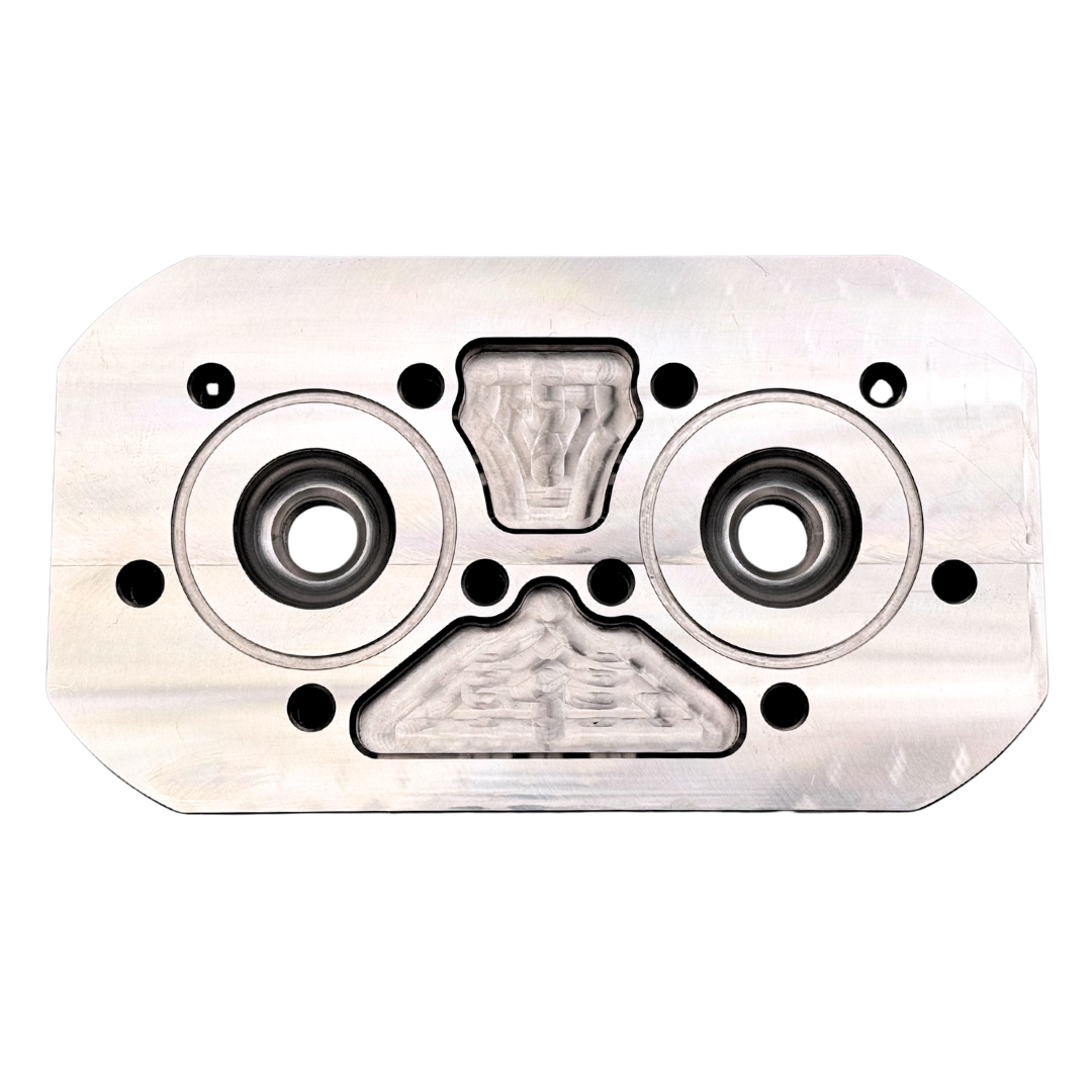 Metallic engine cylinder head on a white background