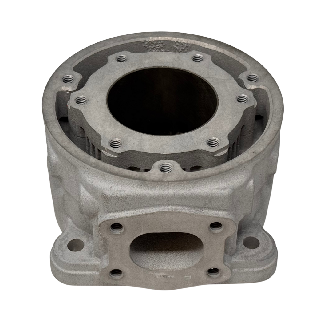 Metal engine cylinder block on a white background