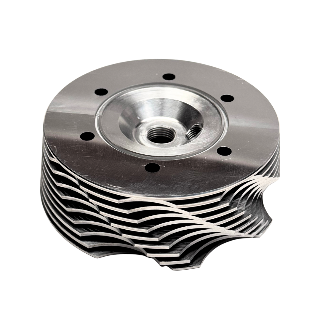 Metal engine cylinder head on a white background