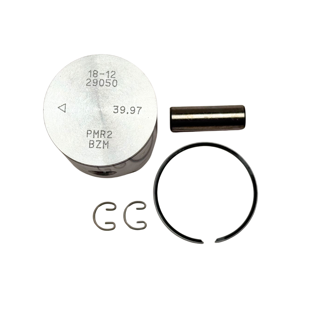 Engine piston, ring, and other components on a white background