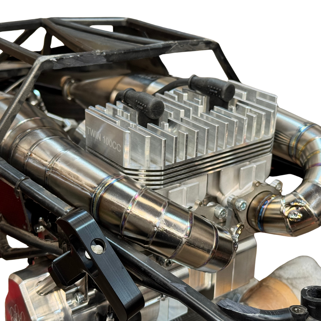 Close-up of an ALX titanium twin exhaust pipe fitted to a Baja engine bay