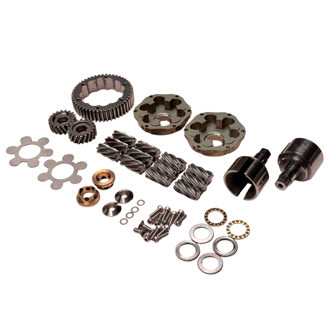 Collection of mechanical parts including gears and bearings on a white background