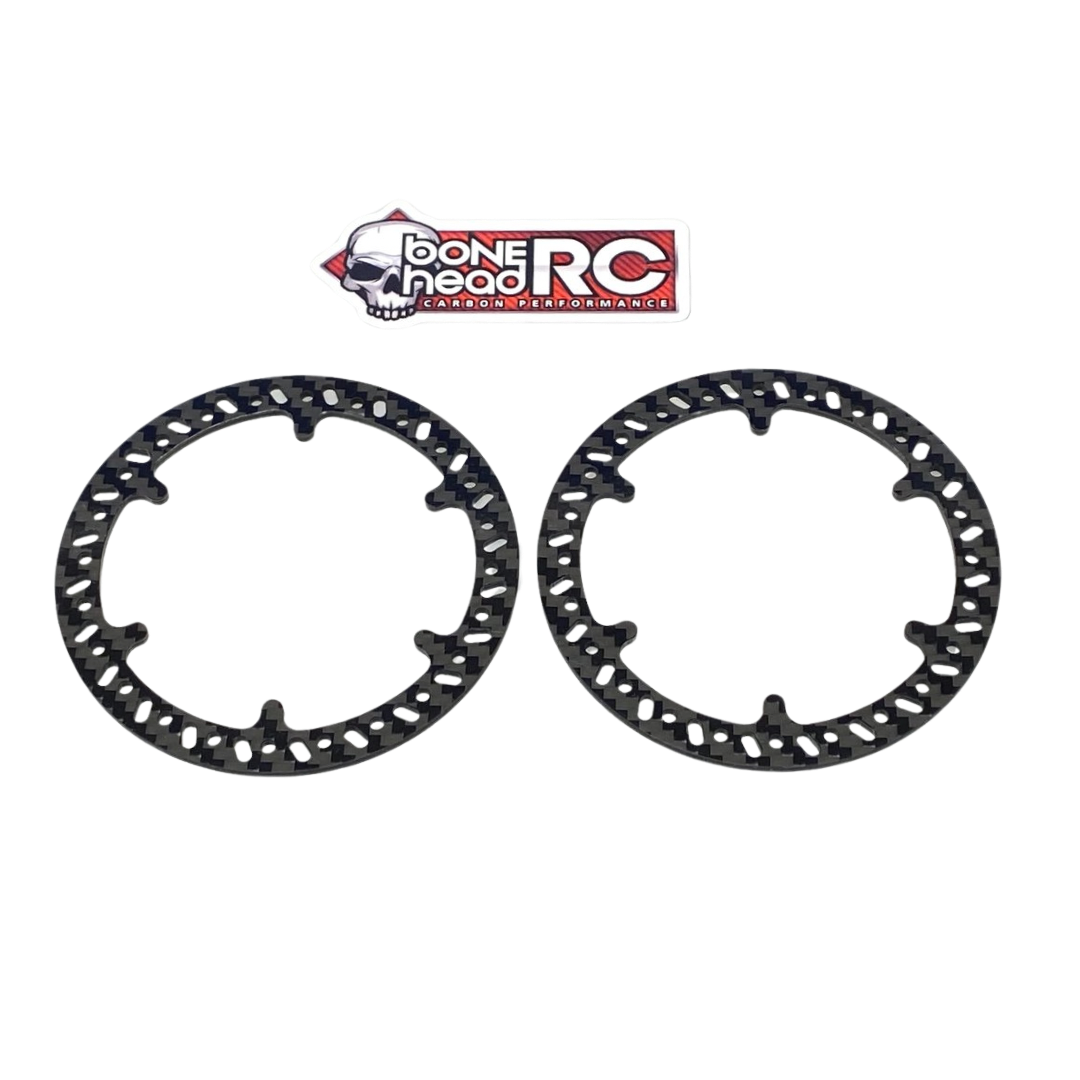 Two black carbon fiber discs with 'Bonehead RC' logo on a white background