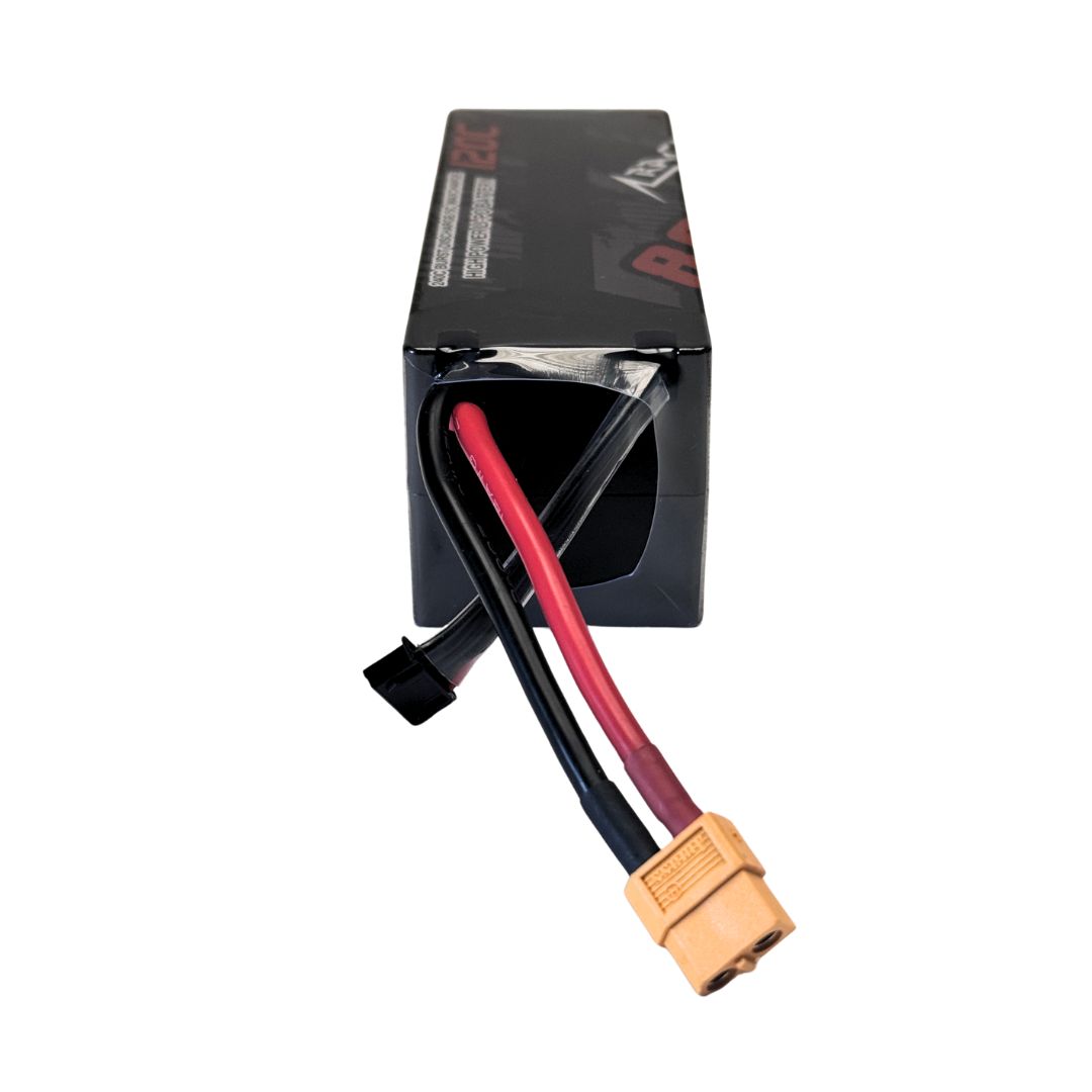 Black battery pack with red and black cables and a yellow connector on a white background