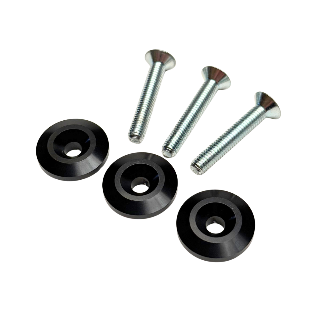 Set of black washers and screws on a white background