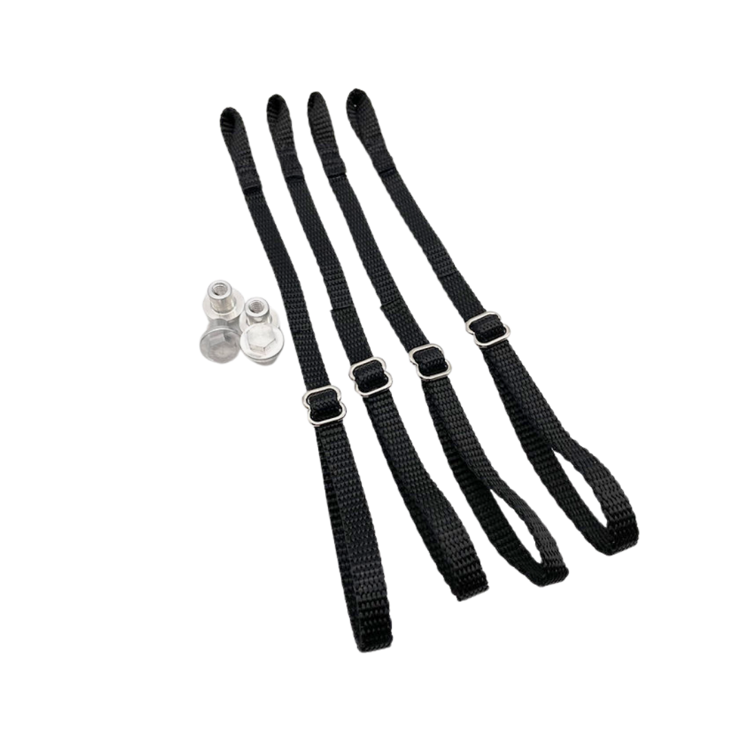 four black straps with metal buckles on a white background