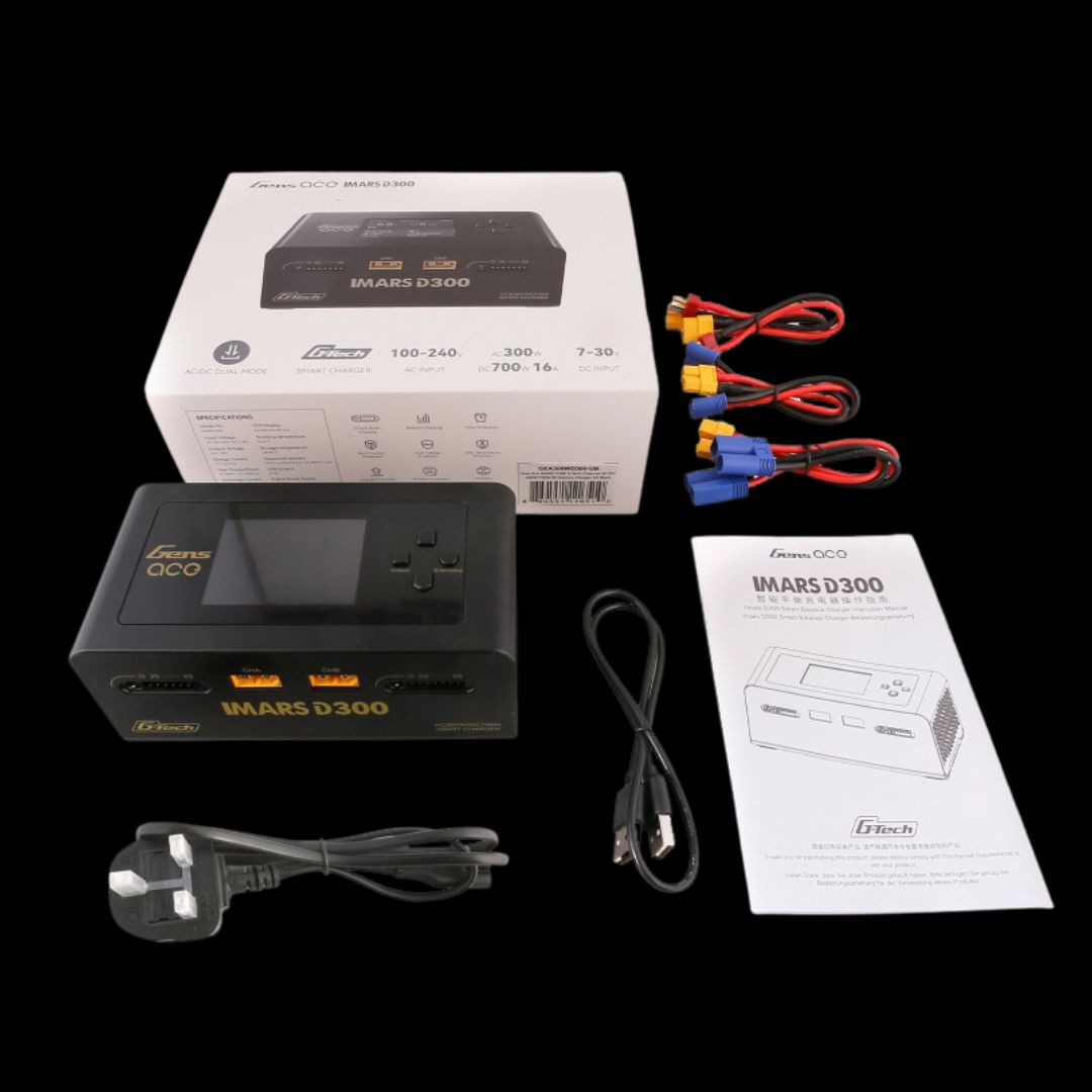 GTech MARS D300 battery charger with packaging, cables, and user manual on a black background