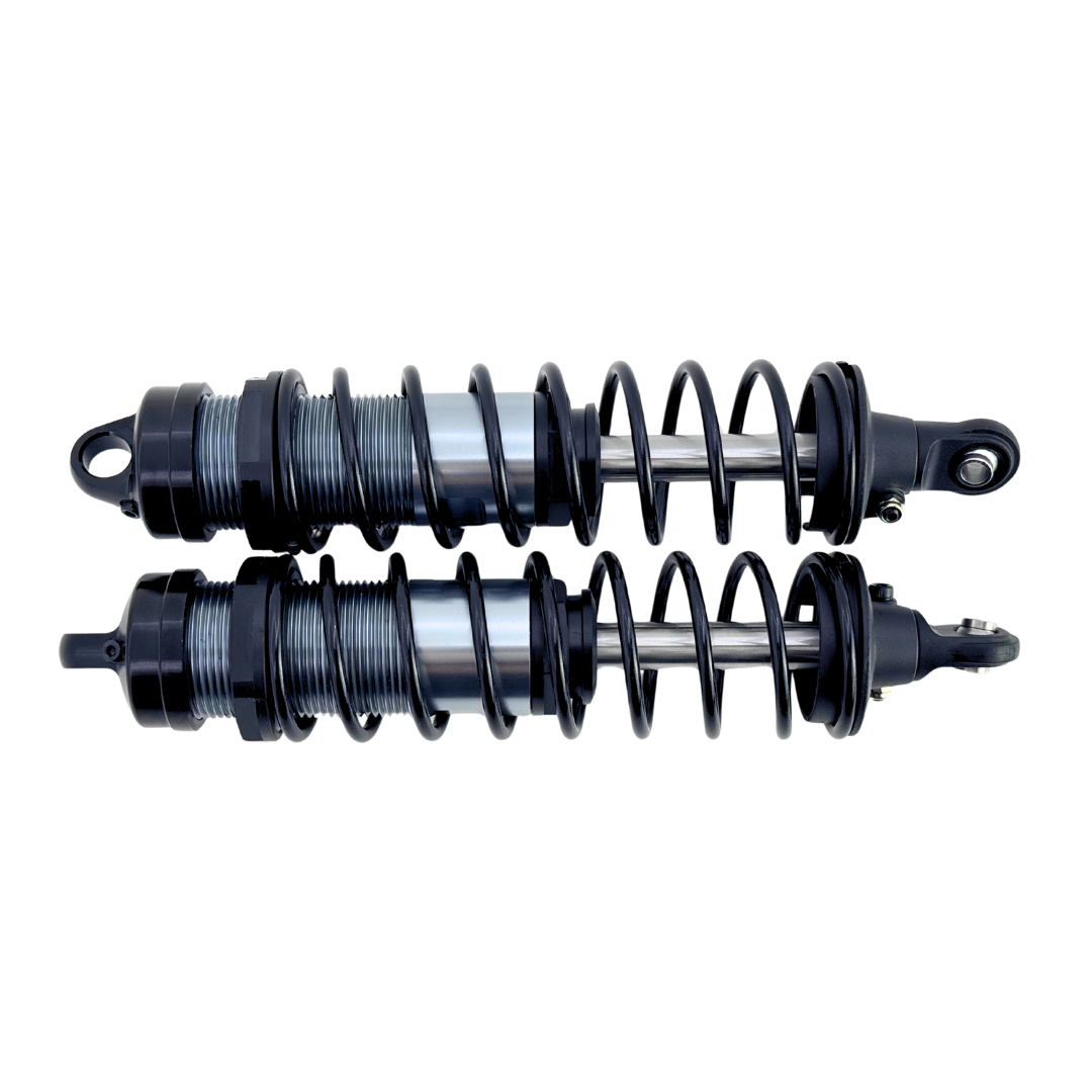 Two shock absorbers on a white background