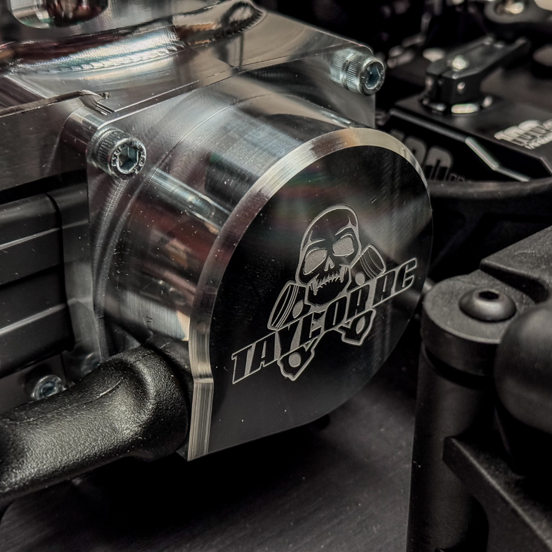Metallic engine cover with 'Taylor RC' logo on a motorcycle