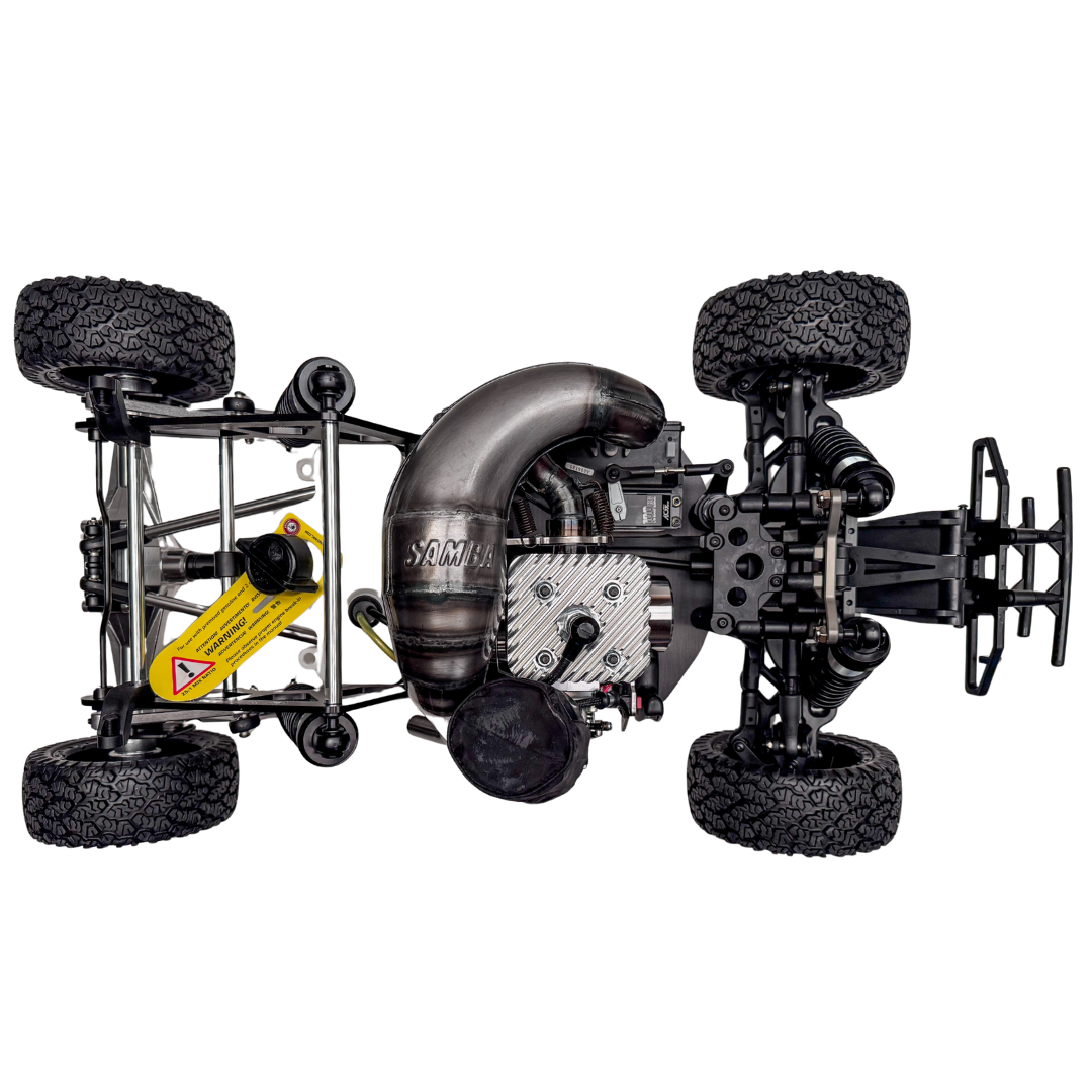 Detailed view of a model car chassis with suspension and engine components on a white background