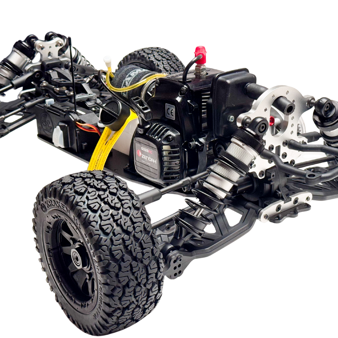 Close-up of a detailed model car chassis with visible components on a white background