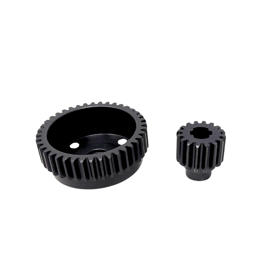 Two black metal gears on a white background