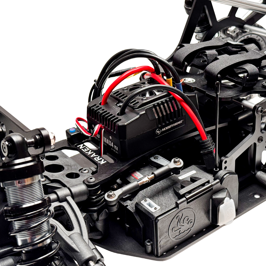 Close-up of a mechanical model with wiring and components on a white background