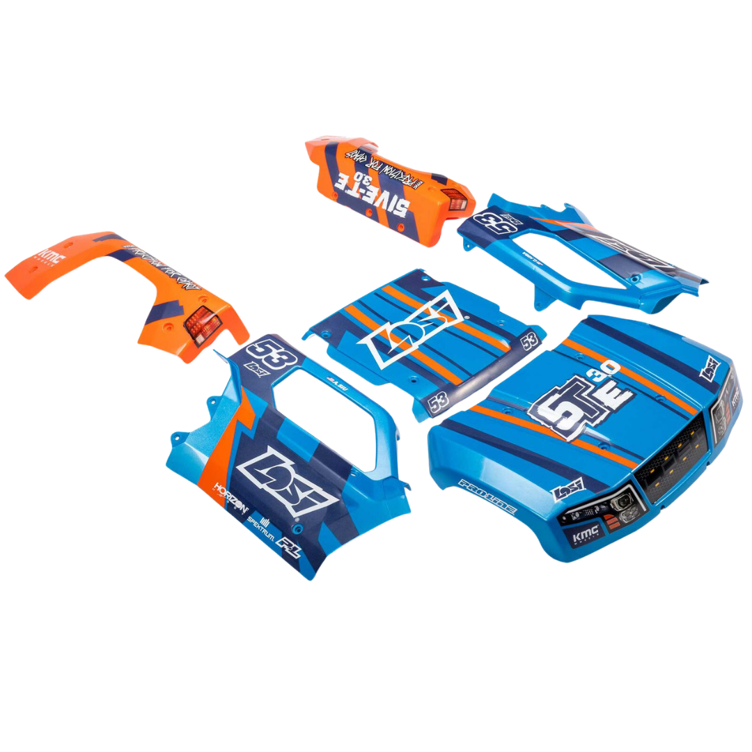 Blue and orange motorcycle body panels with branding on a white background