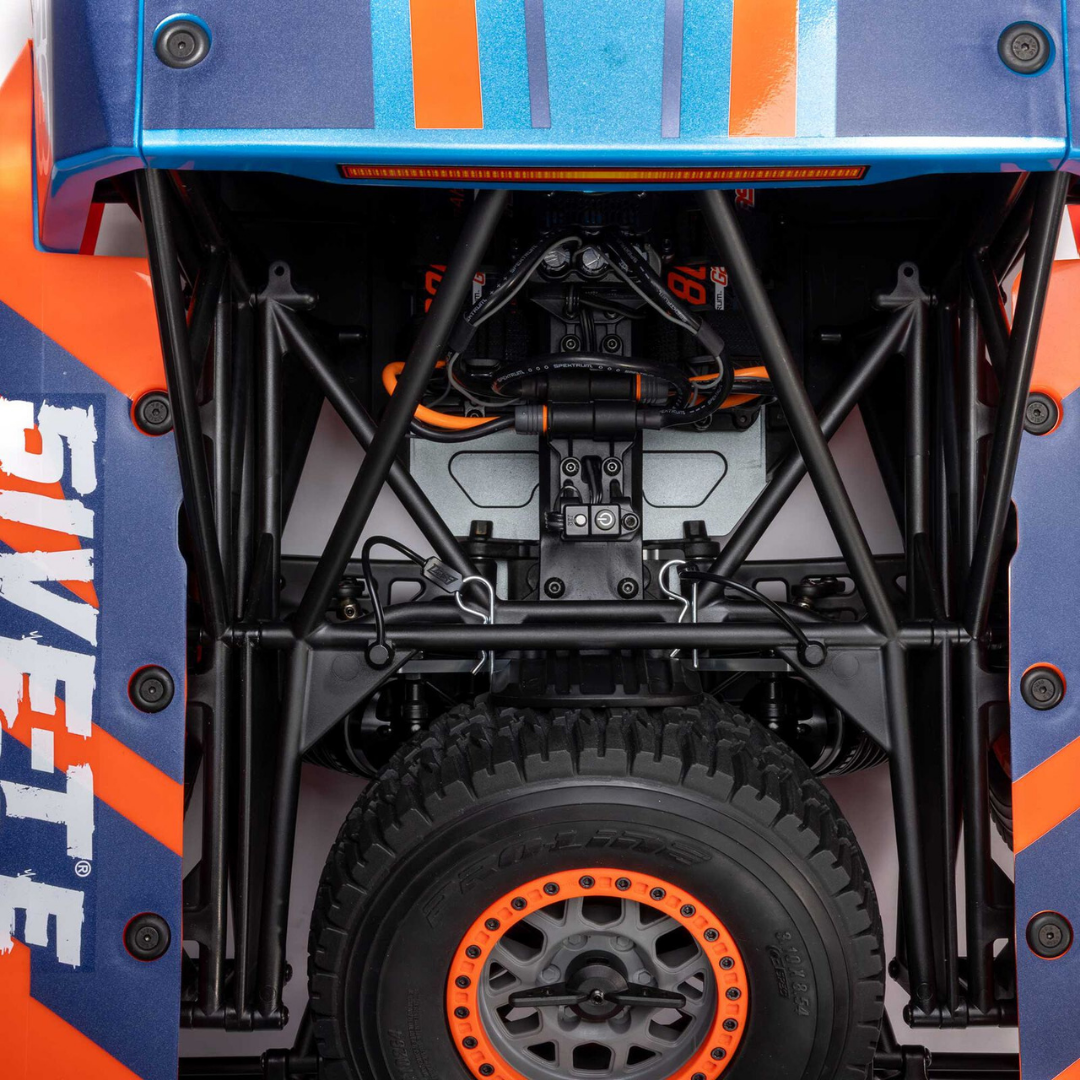 Close-up of a blue and orange off-road vehicle with visible branding.