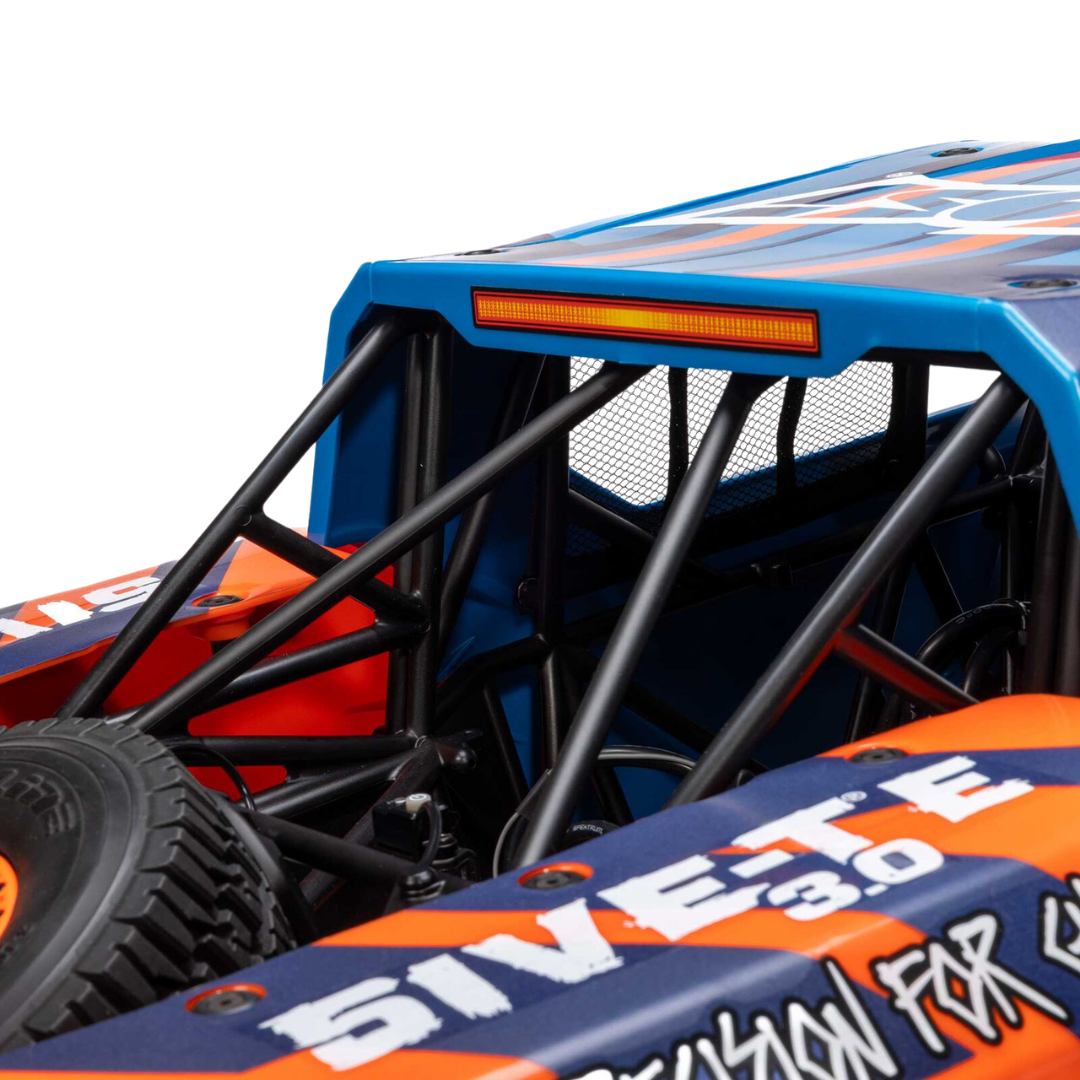 Close-up of a blue and orange off-road vehicle with visible branding.