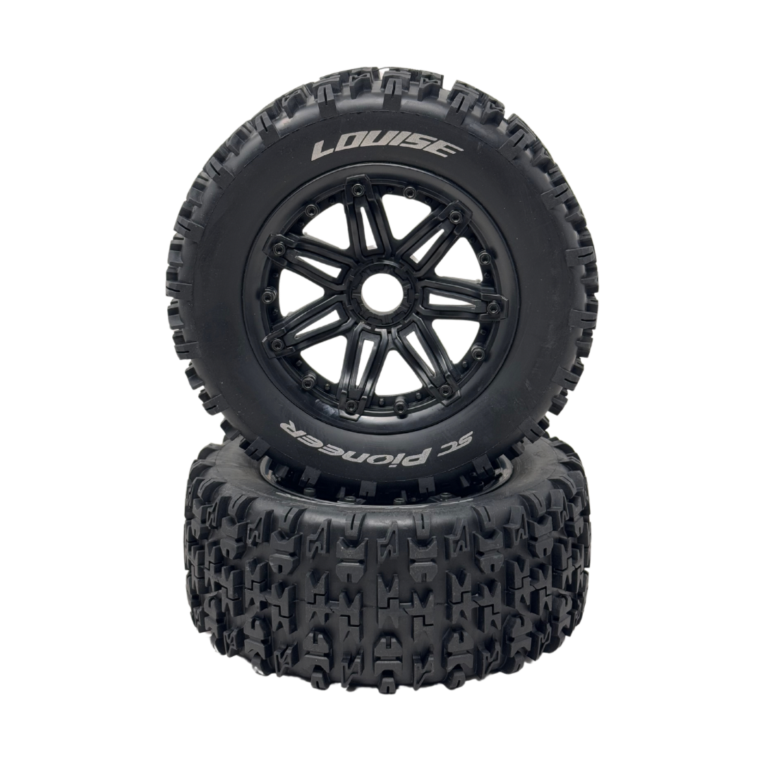 Two black off-road tires with tread patterns on a white background