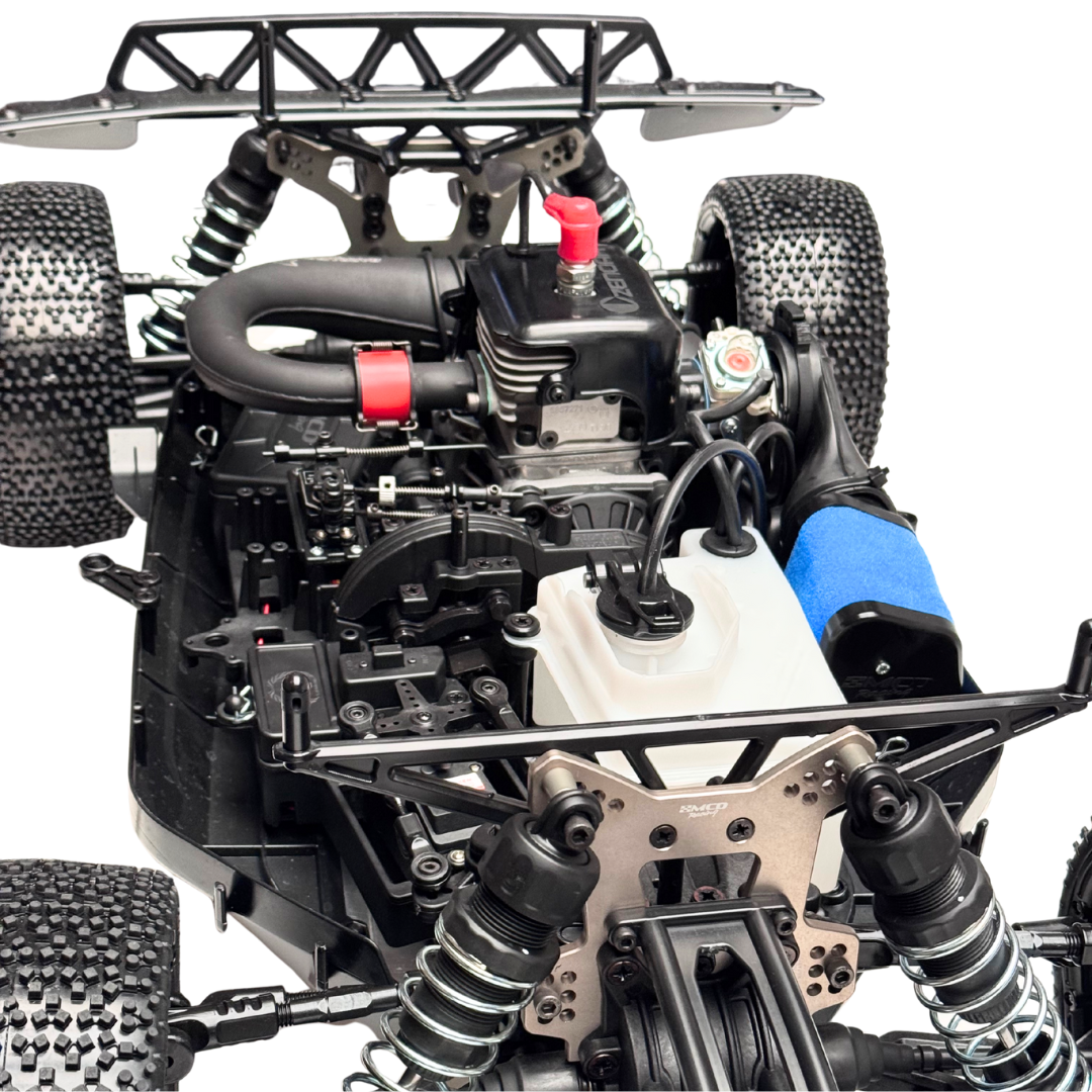 Close-up of a detailed model car chassis with visible components on a white background