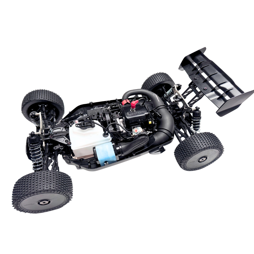 Unassembled model car chassis on a white background