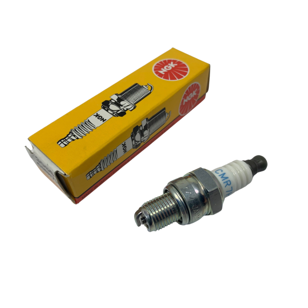 Spark plug and its packaging with a visible brand logo on a white background