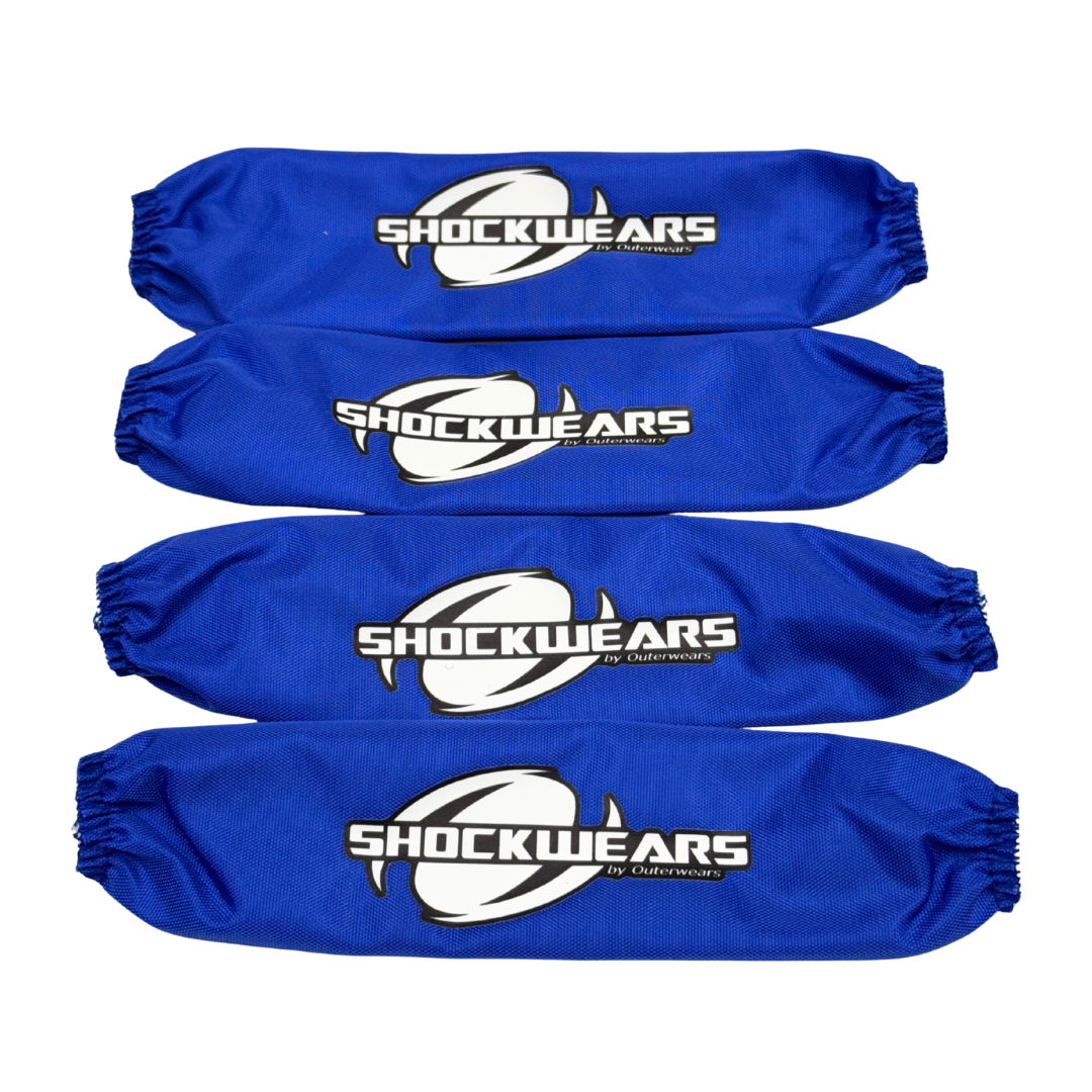 Four blue shock absorber covers with 'Shockwears' branding on a white background