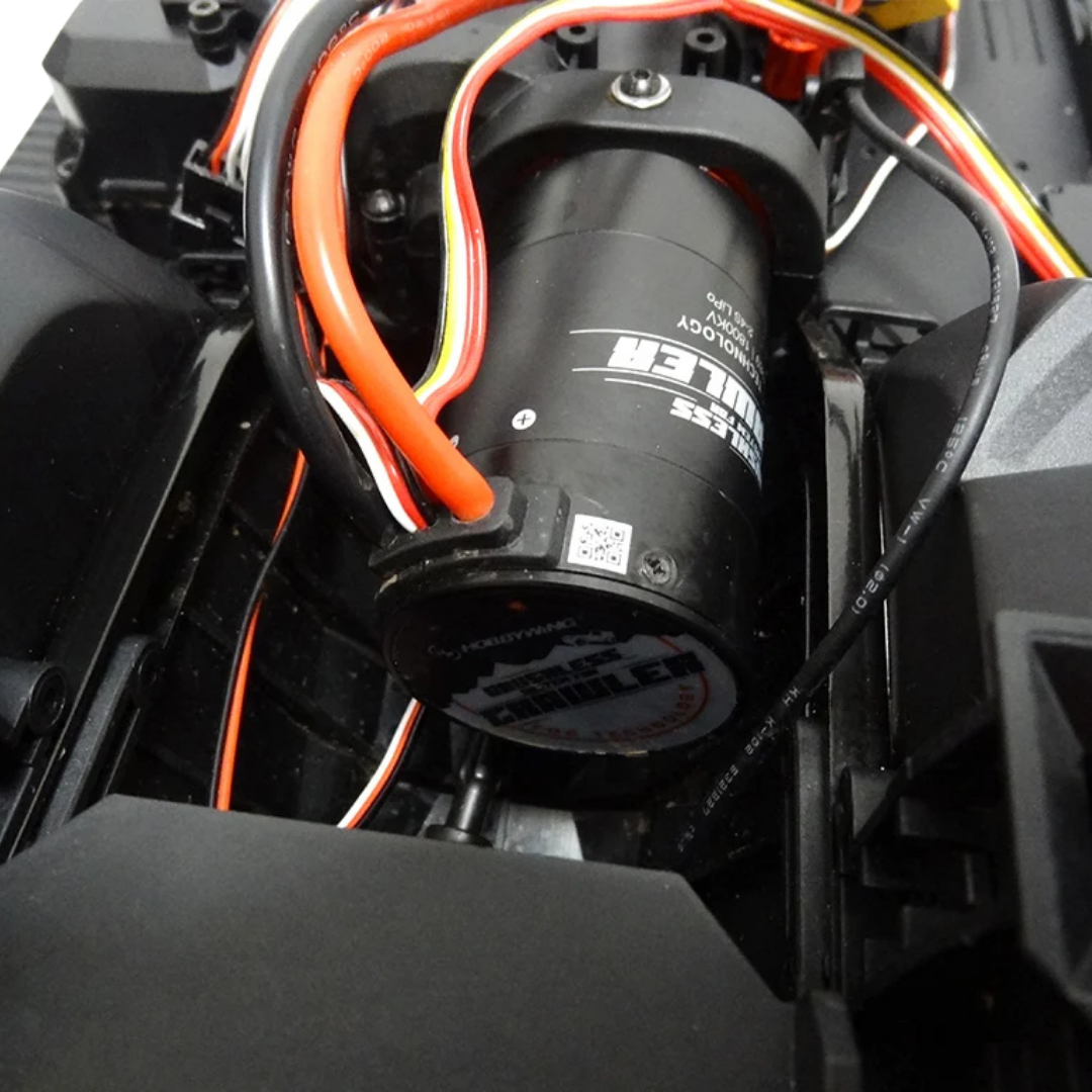 Close-up of a black cylindrical component with visible branding on a mechanical background.
