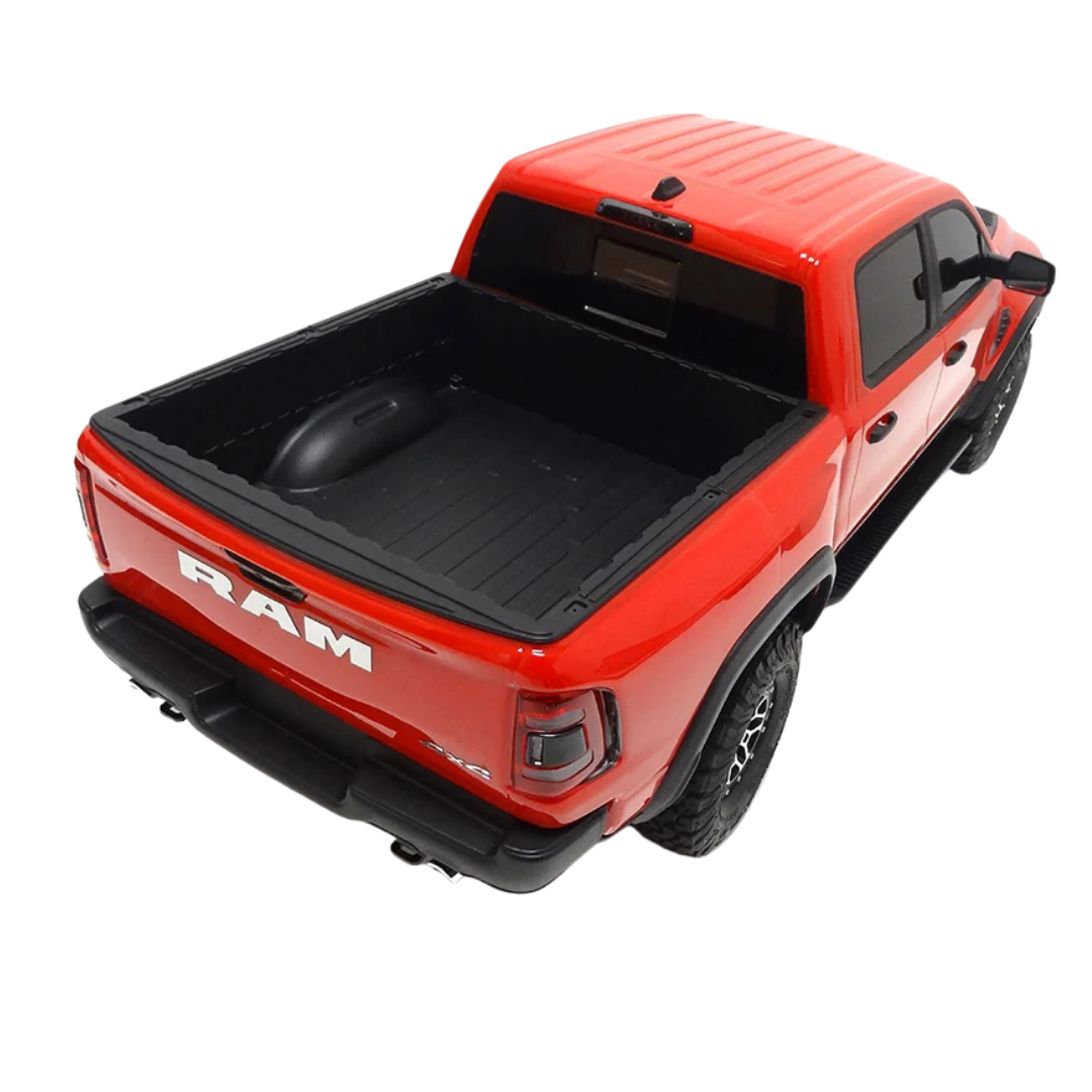Red Ram truck with black bed cover on a white background
