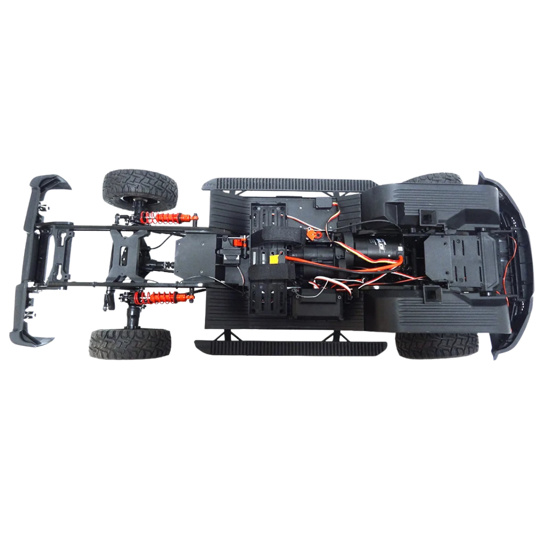 Top view of a black RC car chassis with visible wiring on a white background