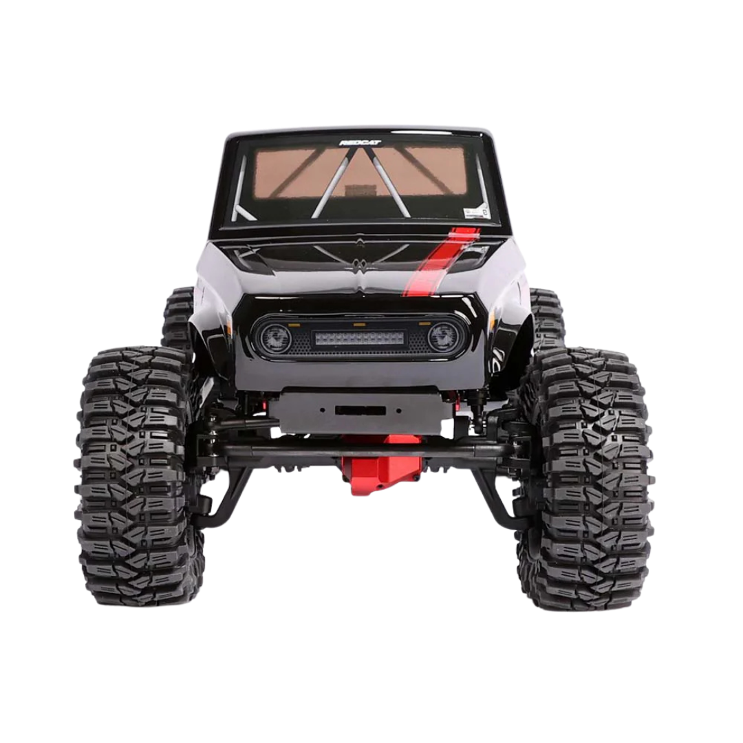 Model of a large off-road vehicle with oversized tires on a white background