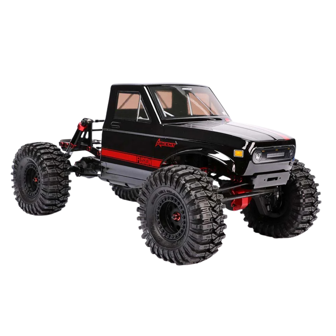 Black off-road model truck with large tires on a white background