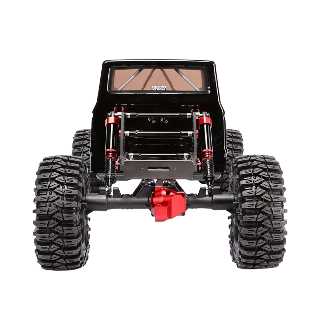 Black off-road vehicle chassis with large tires and red suspension components on a white background