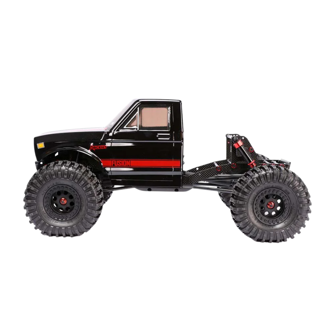 Black off-road toy truck with red accents on a white background