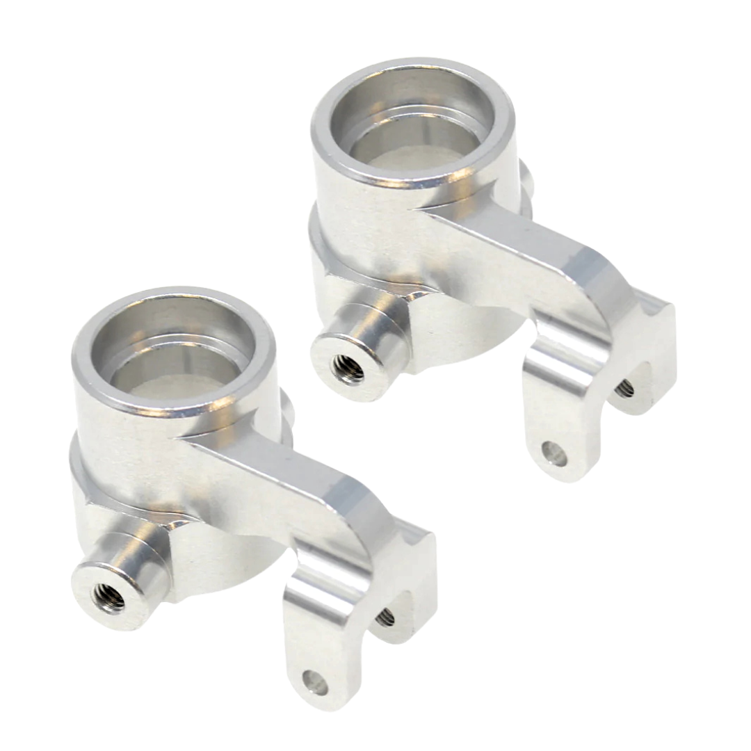 Two metallic metal suspension links on a white background