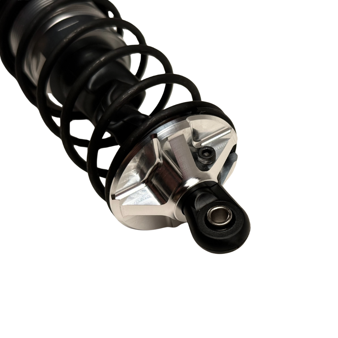 Taylor Losi 5IVE-T 3.0 raw silver billet shock perch fitted to a black shock with spring, showing the machined spokes and grub screw