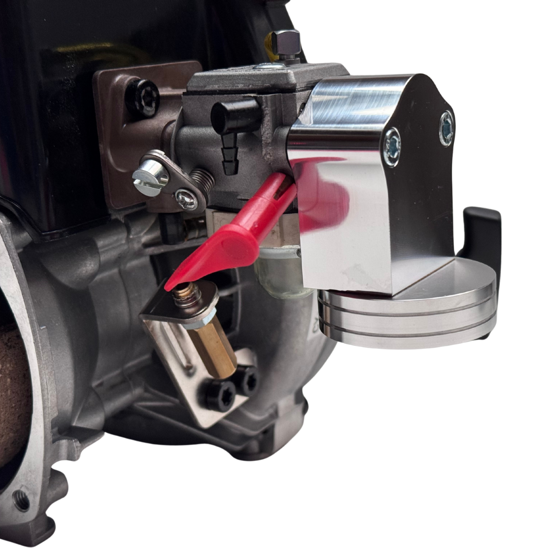 Close-up of a mechanical component with a red lever on a white background