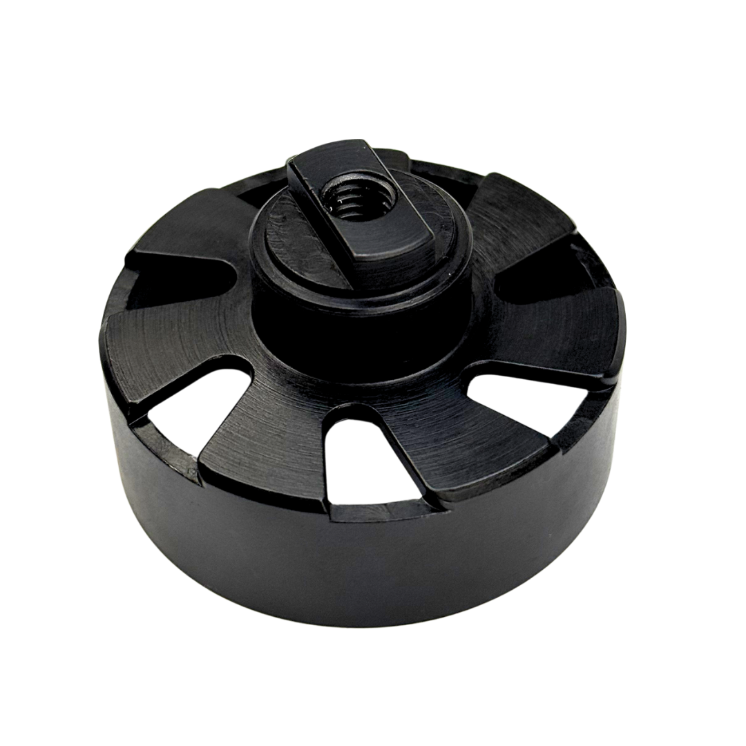 Black metal component with central threaded hole on a white background