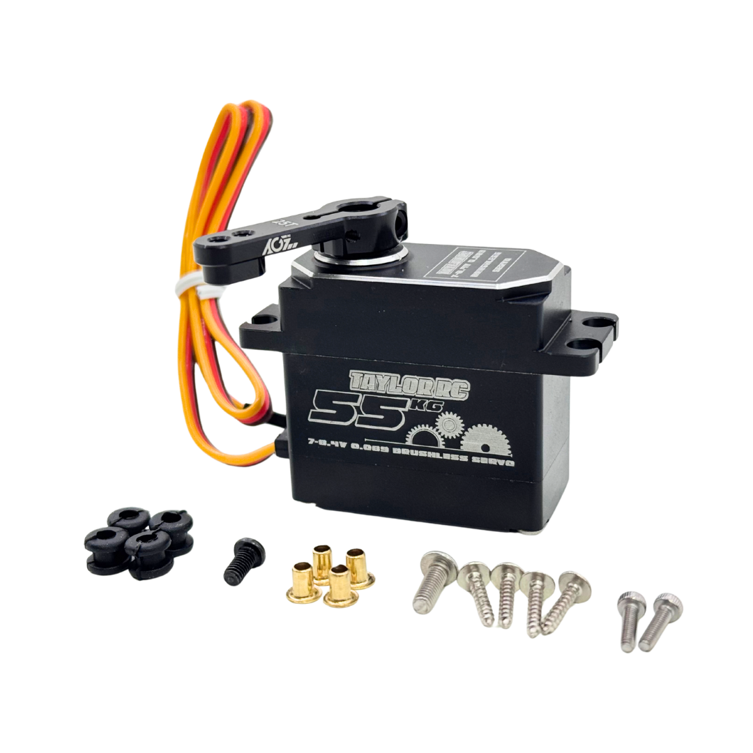 Toy servo motor with wiring and accessories on a white background