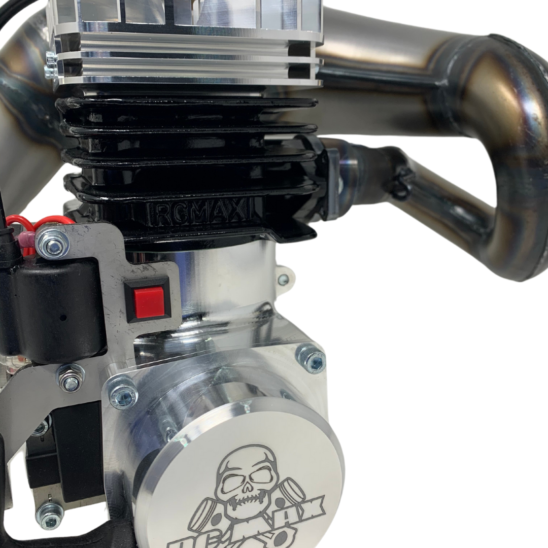 Close-up of a mechanical engine component with 'RCMAX' branding on a white background