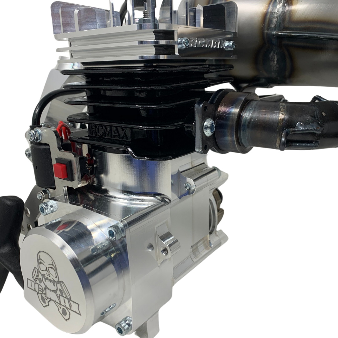 Close-up of a metallic engine with visible branding on a white background