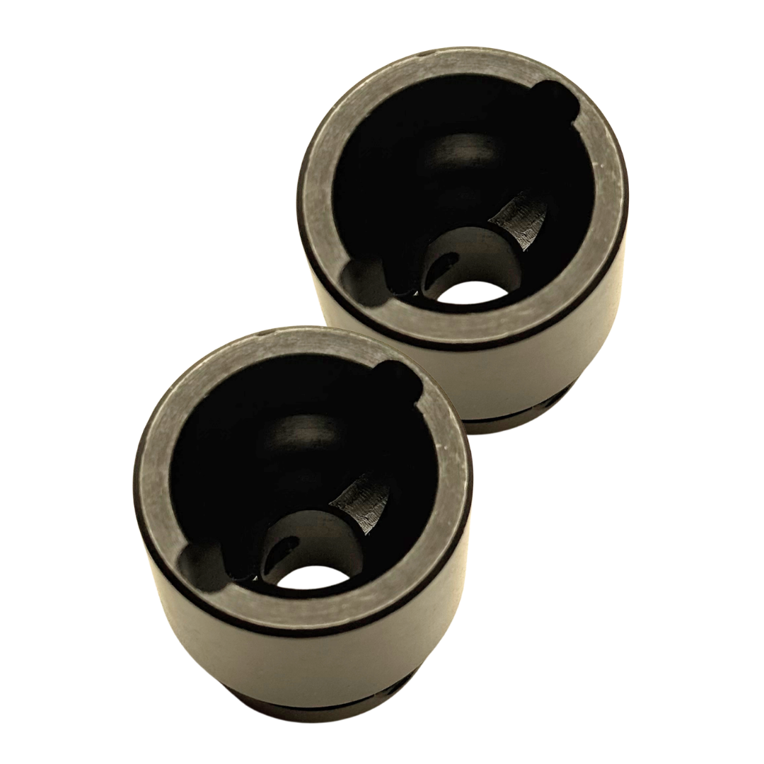 Two black cylindrical mechanical bushings with a matte finish, shown on a plain white background.
