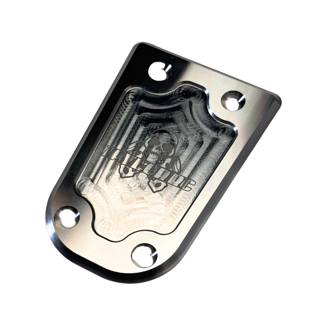 Metallic plate with engraved design on a white background