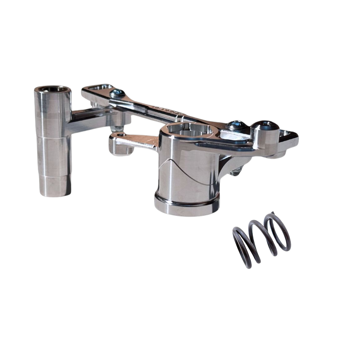 A polished chrome metal mechanical linkage arm with a cylindrical mounting post and a separate black coil spring, shown on a plain white background.
