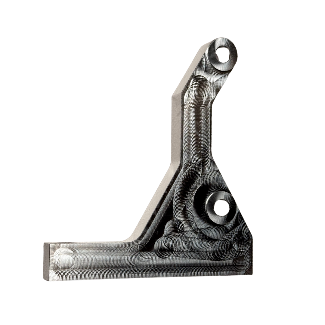 Taylor RC OUTLAW clutch side engine brace in raw silver, front view showing the machined pocketed face and both mounting holes