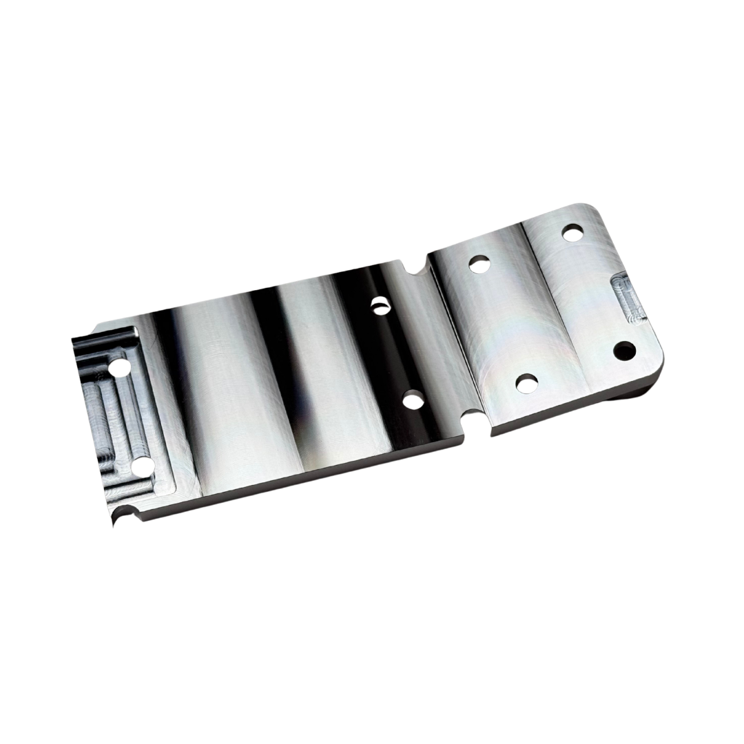 Taylor RC OUTLAW V4 front chassis insert in raw silver, angled view from the opposite corner showing the counterbored top face