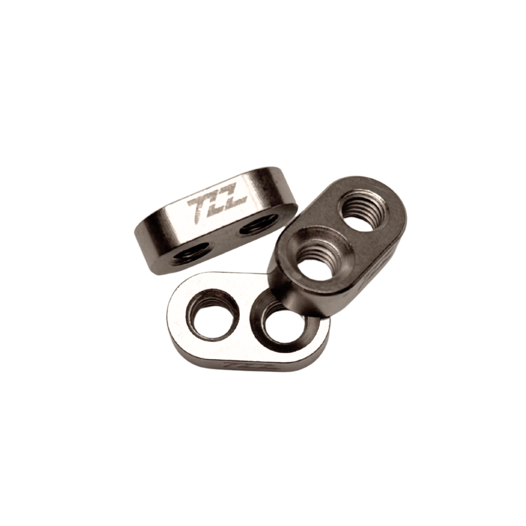 Three metal hardware components with 'TZZ' branding on a white background